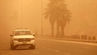 A car is driven along a street in Baghdad, Iraq, during a dust storm (5 May 2022)