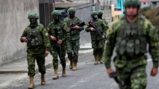 Soldiers patrol a street prior to Sunday's presidential election, in Quito, Ecuador, August 14, 2023.