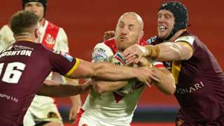 James Roby of St Helens carries the ball against Huddersfield Giants