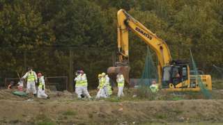 Investigators searching a landfill site
