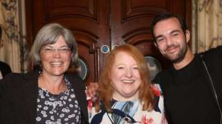 Alliance Party leader Naomi Long (centre) with newly elected Tara Brooks (left) and Micky Murray (right) at Belfast City Hall