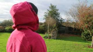 Woman in a pink hoodie