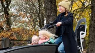 Grit Paulussen and her children with their cargo bike