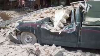 A car crushed by fallen debris after an earthquake in Morocco