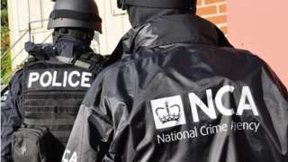 Police and NCA officers