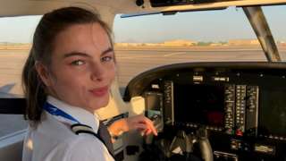 Oriana Pepper at the controls of an airplane