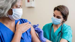 Woman being vaccinated