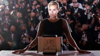 Director Julia Ducournau poses after winning the Palme d'Or award for the film Titane, in Cannes, France, on 17 July 2021