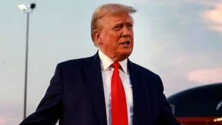 Former US President Donald Trump speaks to the media at Atlanta Hartsfield-Jackson International Airport after surrendering at the Fulton County jail on 24 August 2023 in Atlanta, Georgia.