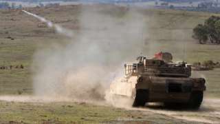 A US Abrams tank firing a shell