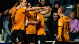 Hull City players celebrate their winner against QPR