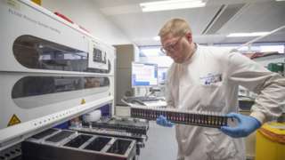 Coronavirus testing laboratory: Clinical support technician Douglas Condie extracts viruses from swab samples