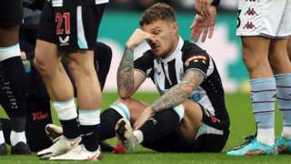 Kieran Trippier reacts after being injured against Aston Villa