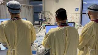 Three doctors in PPE