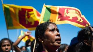 People shout slogans at an anti-government demonstration in Colombo.