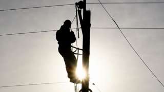 Man fixing power lines
