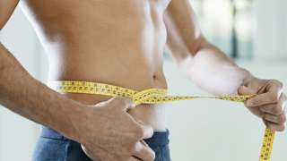 Man measuring his waist