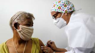 An elderly woman receives a dose of Russia"s Sputnik V coronavirus disease (COVID-19) vaccine in Caracas, Venezuela April 9, 2021.