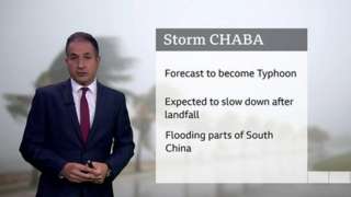 Stav Danaos stands in front of a chart with details about Storm Chaba