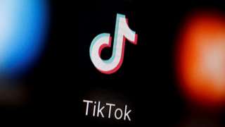A TikTok logo on a smartphone