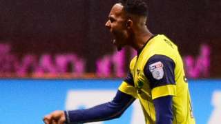 Rob Hall celebrates his goal for Oxford against Oldham