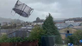 A trampoline flying mid air during Storm Eunice in Builth Wells