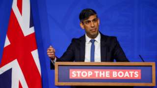 Rishi Sunak attends a press conference at Downing Street in London