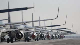 Passenger planes parked on a runway on 26 May