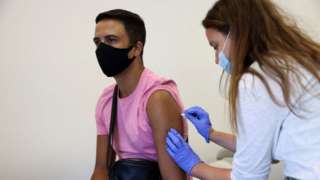 Woman receives a monkeypox vaccine