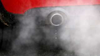 A car exhaust emits fumes
