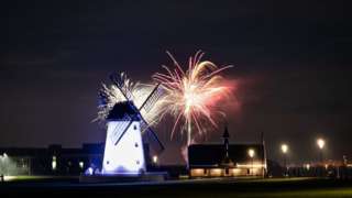 Fireworks behind a windmill in Lytham St Annes, Lancashire