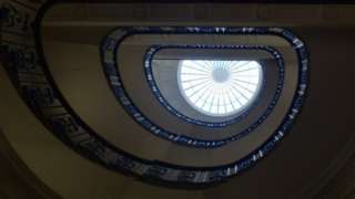 A staircase spiral with a window on top