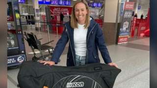 Sian Hurley collects her bike at Newcastle Airport