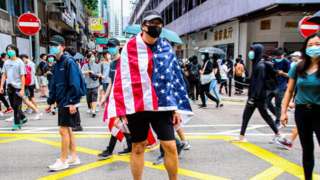One Hong Kong protester is draped with the US flag during the 24th May 2020 protests.
