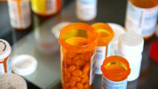 Stock image of pills in bottles