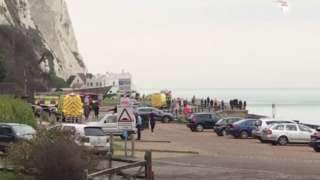 The base jumper had to be winched back up the cliff after falling halfway down