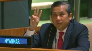Myanmar's ambassador to the United Nations Kyaw Moe Tun holds up three fingers