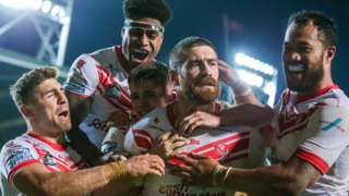 St Helens celebrate Kyle Amor (centre) scoring against Hull KR
