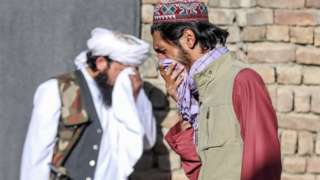 Worshippers react at the scene of an attack that targeted a mosque in the outskirt of Kabul, Afghanistan, 14 May 2021.