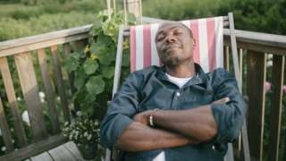 A man napping in a deckchair