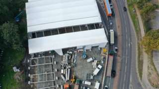 Aerial view of the tents being erected at Trinity Street burial ground