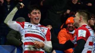 Louis Rees-Zammit celebrates scoring a try against Montpellier