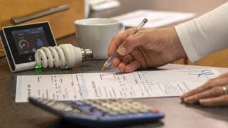 Woman going through energy bills