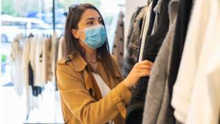 Woman shopping while wearing face mask