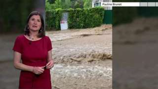 BBC Weather's Helen Willetts in front of flood pictures