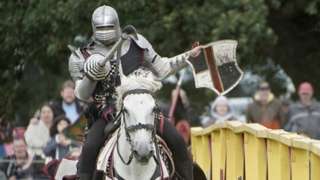 A knight on horseback taking part in a joust