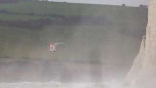 A HM Coastguard helicopter over choppy seas