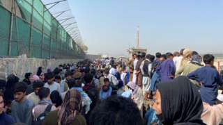General view of the crowds of people near the airport in Kabul,