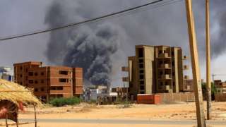 Smoke rises above a building