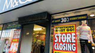 Sore closing signs at an M&Co store in Peterhead